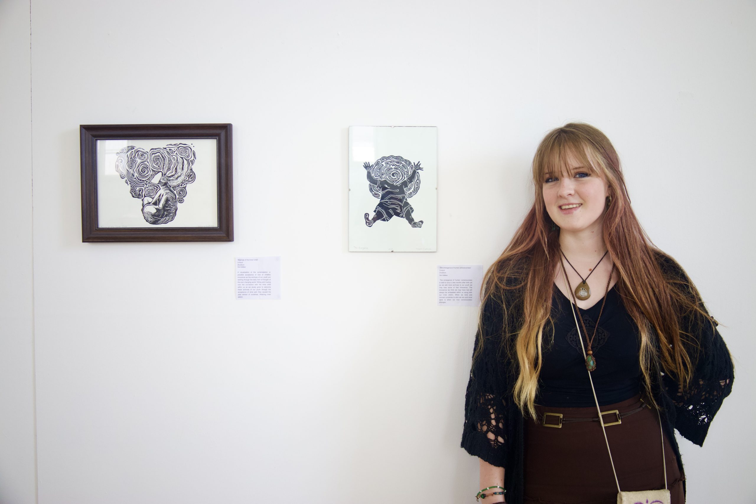 Tori Ciolkosz ArchiveOfOurYouth artist standing with their art