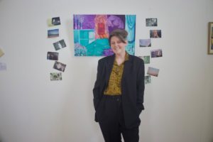 Alyssa Delahan Meade ArchiveOfOurYouth artist standing with their art